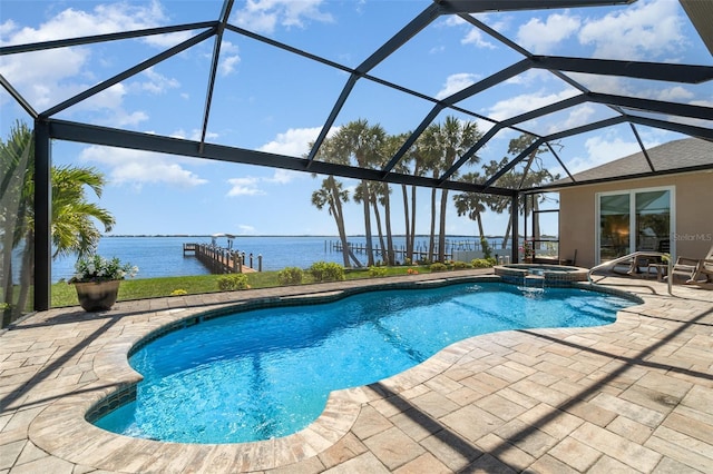 view of swimming pool with a patio area, glass enclosure, a pool with connected hot tub, and a water view