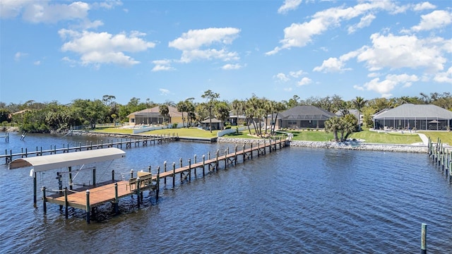 dock area with a yard, a water view, and a residential view