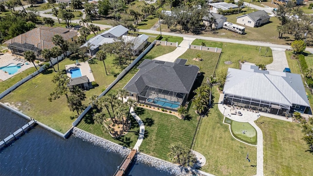 bird's eye view featuring a residential view and a water view