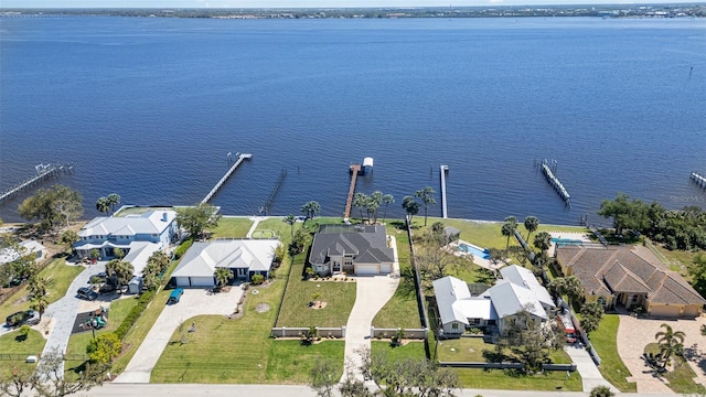 drone / aerial view with a residential view and a water view