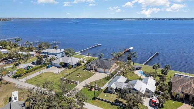 drone / aerial view featuring a residential view and a water view