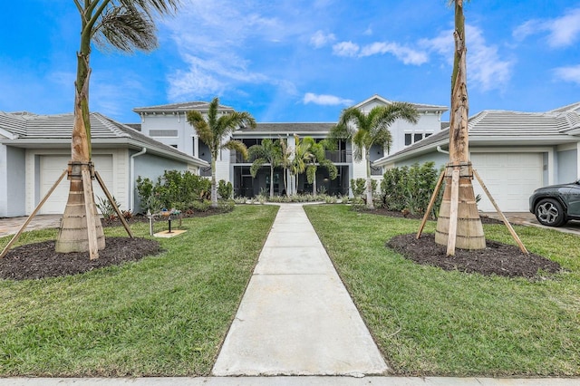 exterior space featuring a garage and a lawn