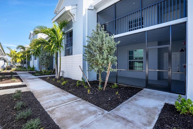 view of side of property featuring stucco siding