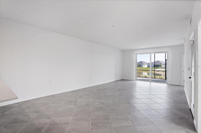 tiled spare room with baseboards