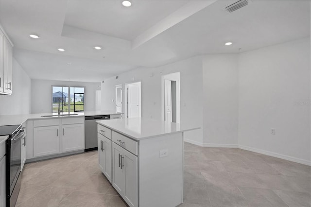 kitchen featuring electric range, a sink, visible vents, light countertops, and dishwasher