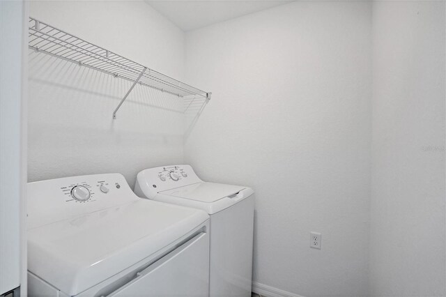 laundry room featuring laundry area and washing machine and dryer