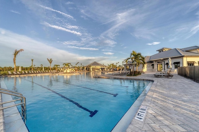 view of swimming pool with a patio area