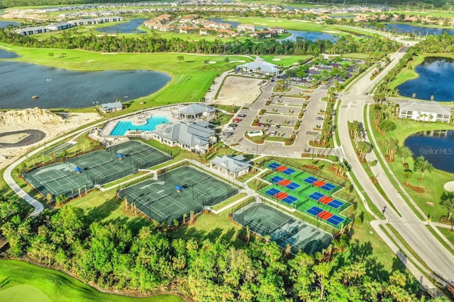 bird's eye view featuring view of golf course and a water view