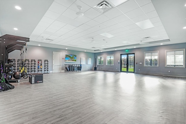 gym featuring recessed lighting, wood finished floors, visible vents, and baseboards