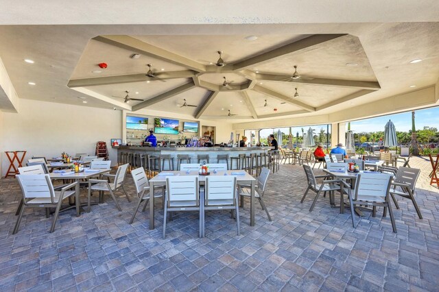 dining space with ceiling fan and recessed lighting