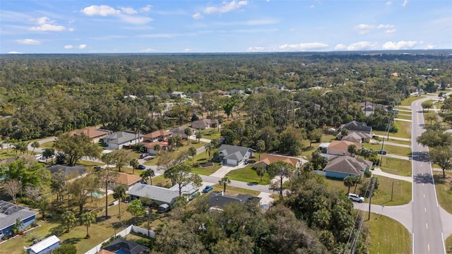 aerial view featuring a view of trees and a residential view