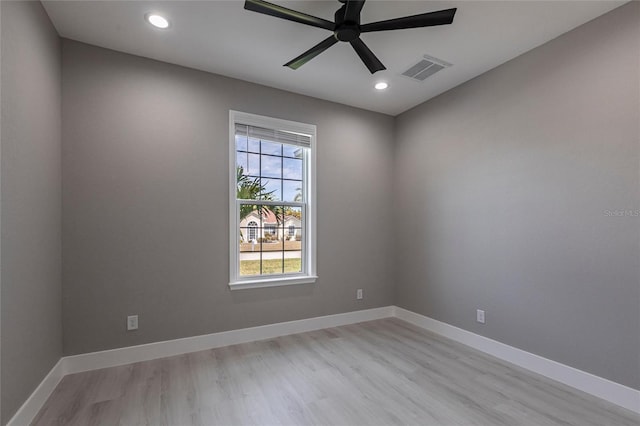 unfurnished room featuring baseboards, visible vents, a ceiling fan, light wood-style floors, and recessed lighting