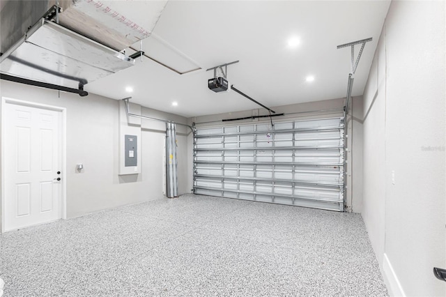 garage with electric panel and a garage door opener