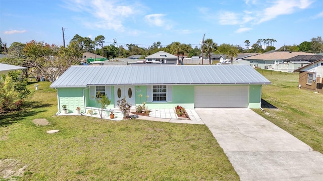 single story home featuring a front yard, driveway, stucco siding, a garage, and metal roof