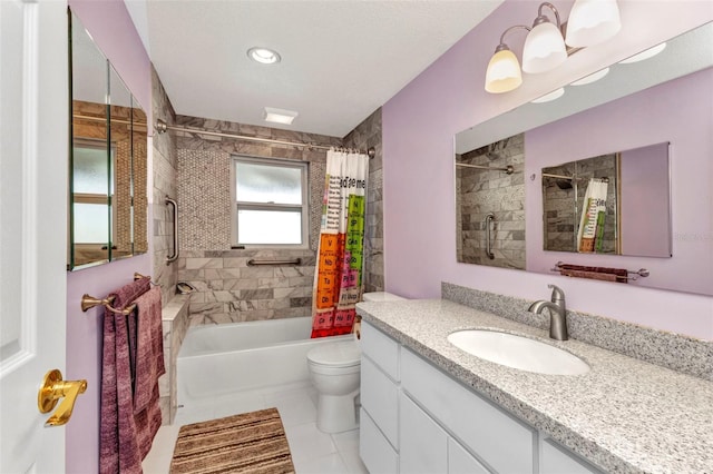 full bathroom with tile patterned floors, shower / tub combo with curtain, vanity, and toilet