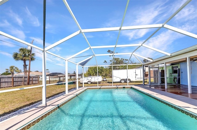 view of swimming pool featuring a patio, a fenced in pool, fence, and a lanai