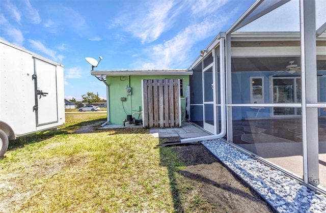 view of yard featuring a sunroom