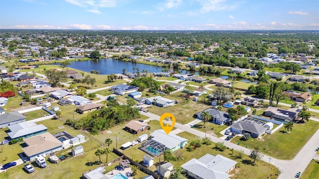 birds eye view of property with a water view and a residential view