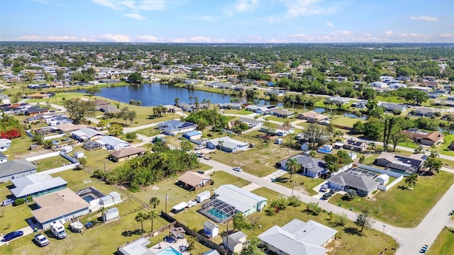 bird's eye view with a residential view and a water view