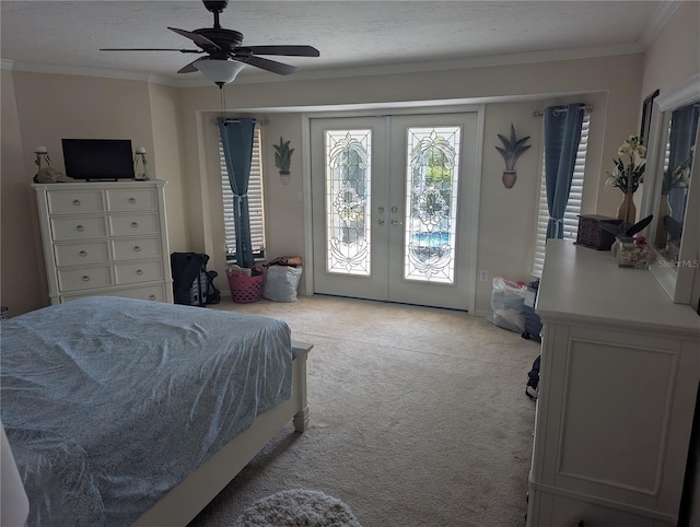 carpeted bedroom featuring access to exterior, french doors, a textured ceiling, and crown molding