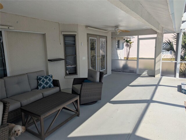 view of patio featuring french doors, outdoor lounge area, a lanai, and a ceiling fan