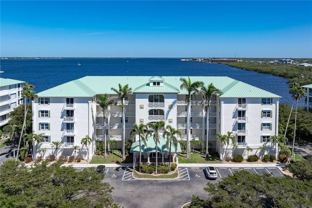 birds eye view of property with a water view