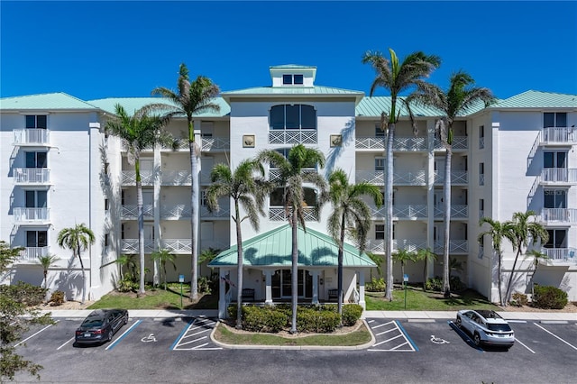 view of property with uncovered parking