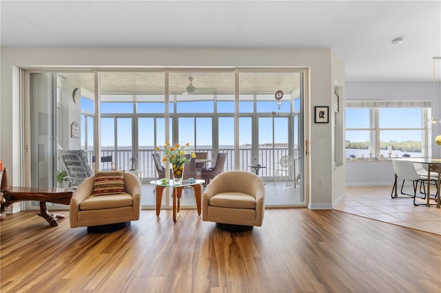 sitting room with wood finished floors and baseboards