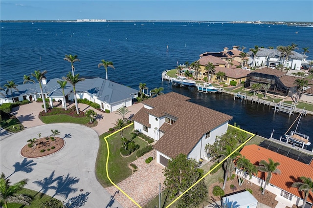 birds eye view of property with a residential view and a water view