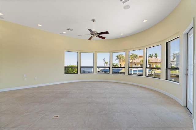 unfurnished room featuring a ceiling fan, recessed lighting, baseboards, and visible vents