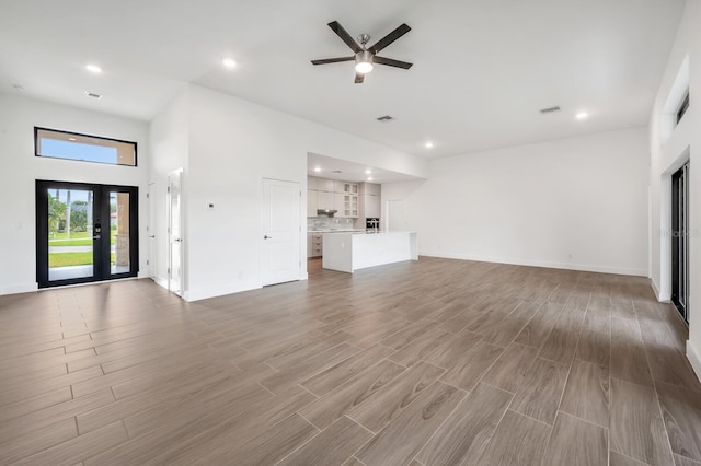 17261 Naiad Ct, Punta Gorda, FL 33955 - unfurnished living room with recessed lighting, ceiling fan, baseboards, and wood finished floors