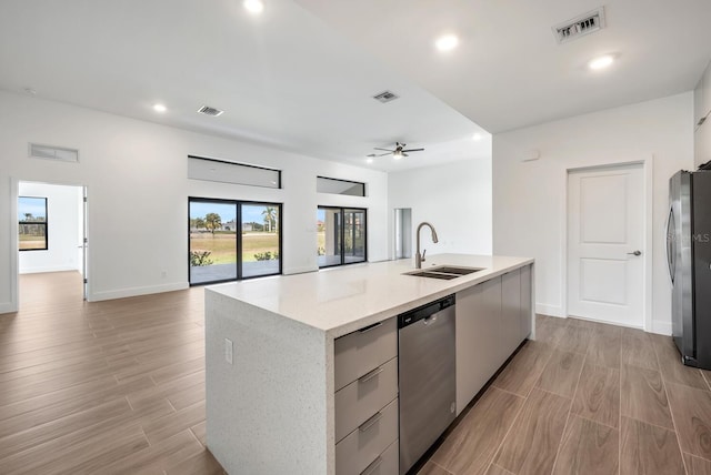 17261 Naiad Ct, Punta Gorda, FL 33955 - kitchen featuring stainless steel appliances, a sink, open floor plan, recessed lighting, and light wood-type flooring
