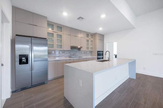 17261 Naiad Ct, Punta Gorda, FL 33955 - kitchen featuring stainless steel fridge with ice dispenser, wood finish floors, a sink, modern cabinets, and recessed lighting