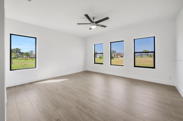 17261 Naiad Ct, Punta Gorda, FL 33955 - spare room featuring wood finished floors, baseboards, and a ceiling fan