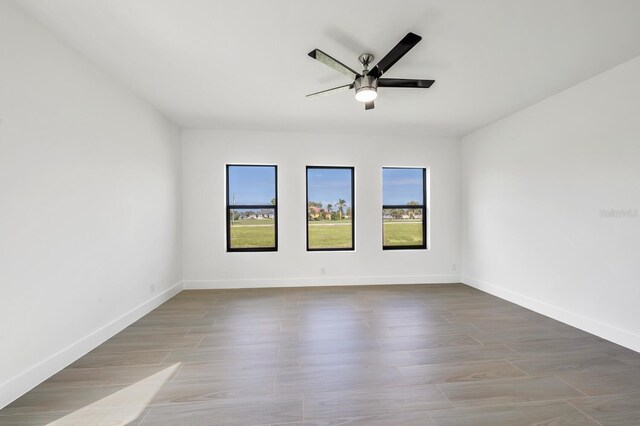 17261 Naiad Ct, Punta Gorda, FL 33955 - spare room featuring a ceiling fan, baseboards, and wood finished floors