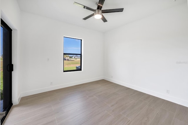 17261 Naiad Ct, Punta Gorda, FL 33955 - spare room featuring a ceiling fan, light wood-style floors, and baseboards