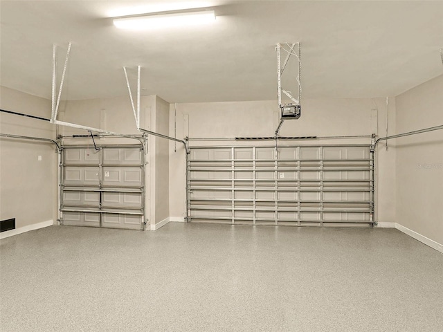 17261 Naiad Ct, Punta Gorda, FL 33955 - garage with baseboards and a garage door opener