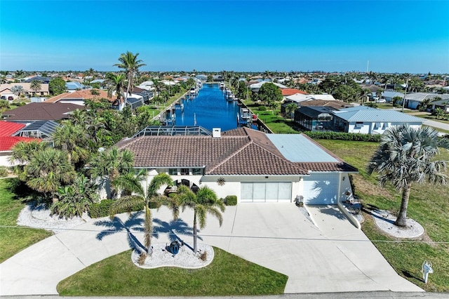 aerial view with a water view and a residential view