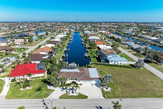 bird's eye view featuring a water view and a residential view