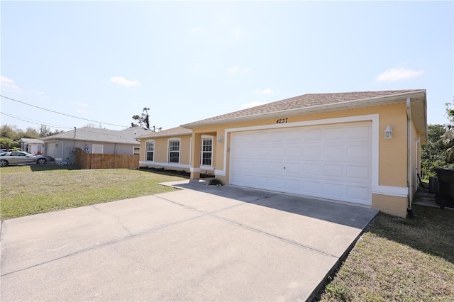 ranch-style house with stucco siding, a front lawn, driveway, fence, and a garage