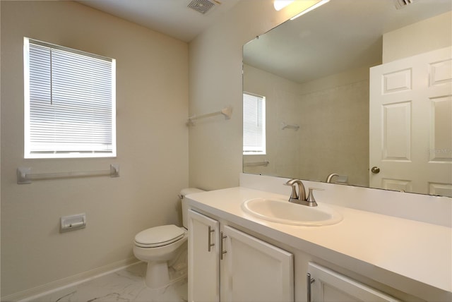 bathroom featuring vanity, visible vents, baseboards, toilet, and marble finish floor