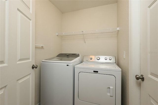 laundry area featuring laundry area and separate washer and dryer