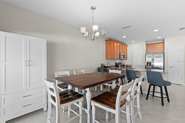 dining room featuring light tile patterned flooring, visible vents, recessed lighting, and a notable chandelier