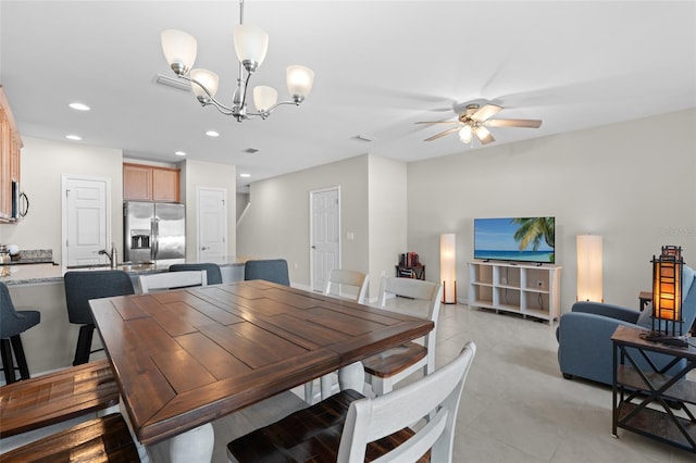 dining area with recessed lighting, visible vents, light tile patterned flooring, and ceiling fan with notable chandelier