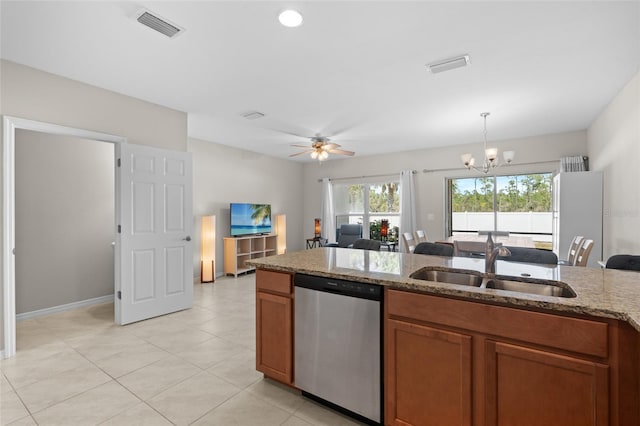 kitchen featuring visible vents, brown cabinets, dishwasher, and a sink