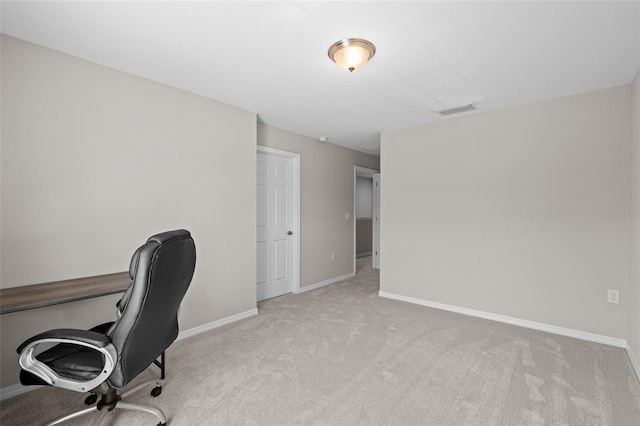 unfurnished office featuring baseboards, visible vents, and carpet floors