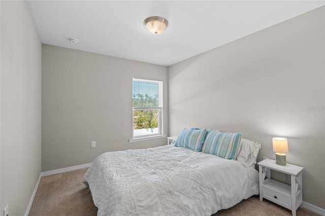 carpeted bedroom with baseboards