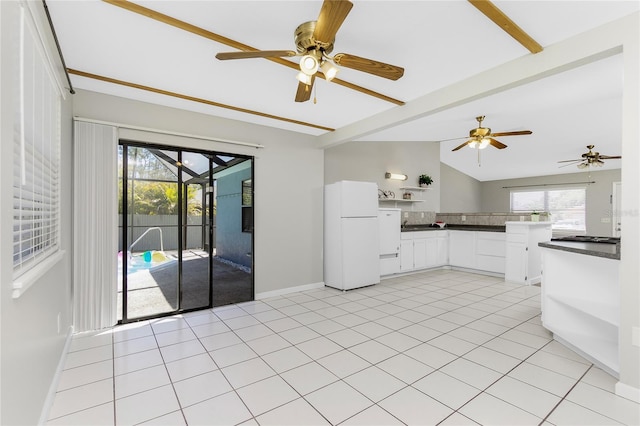 kitchen featuring dark countertops, ceiling fan, freestanding refrigerator, white cabinets, and open shelves