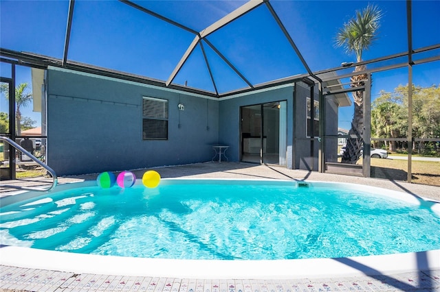 pool with a patio and a lanai