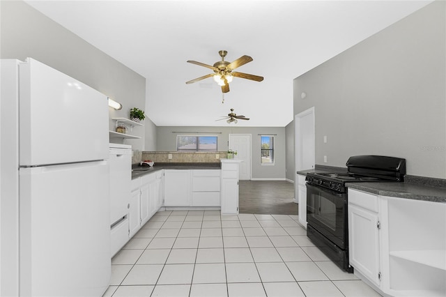 kitchen with dark countertops, ceiling fan, freestanding refrigerator, black electric range oven, and open shelves